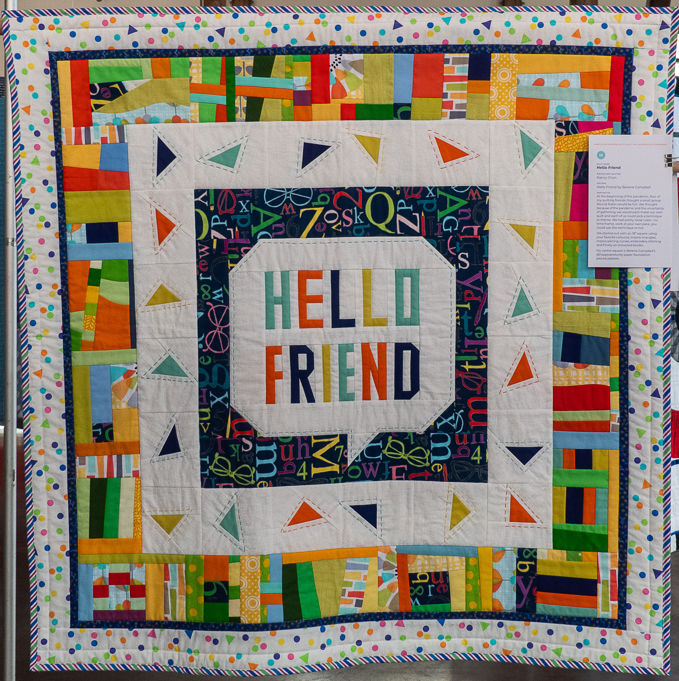 Modern quilt with a dialogue box containing the words "hello friend"