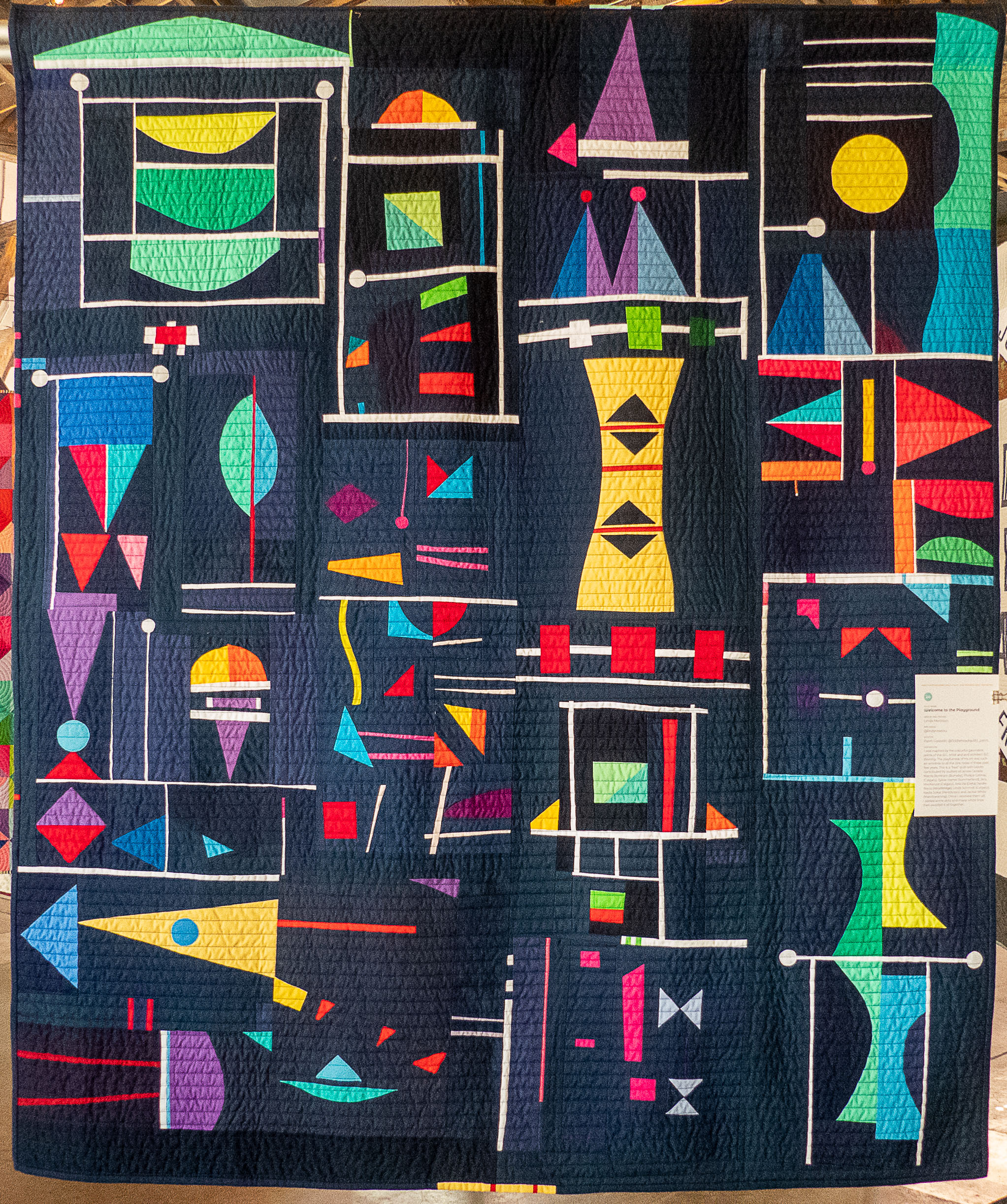 modern quilt with colourful geometric shapes
