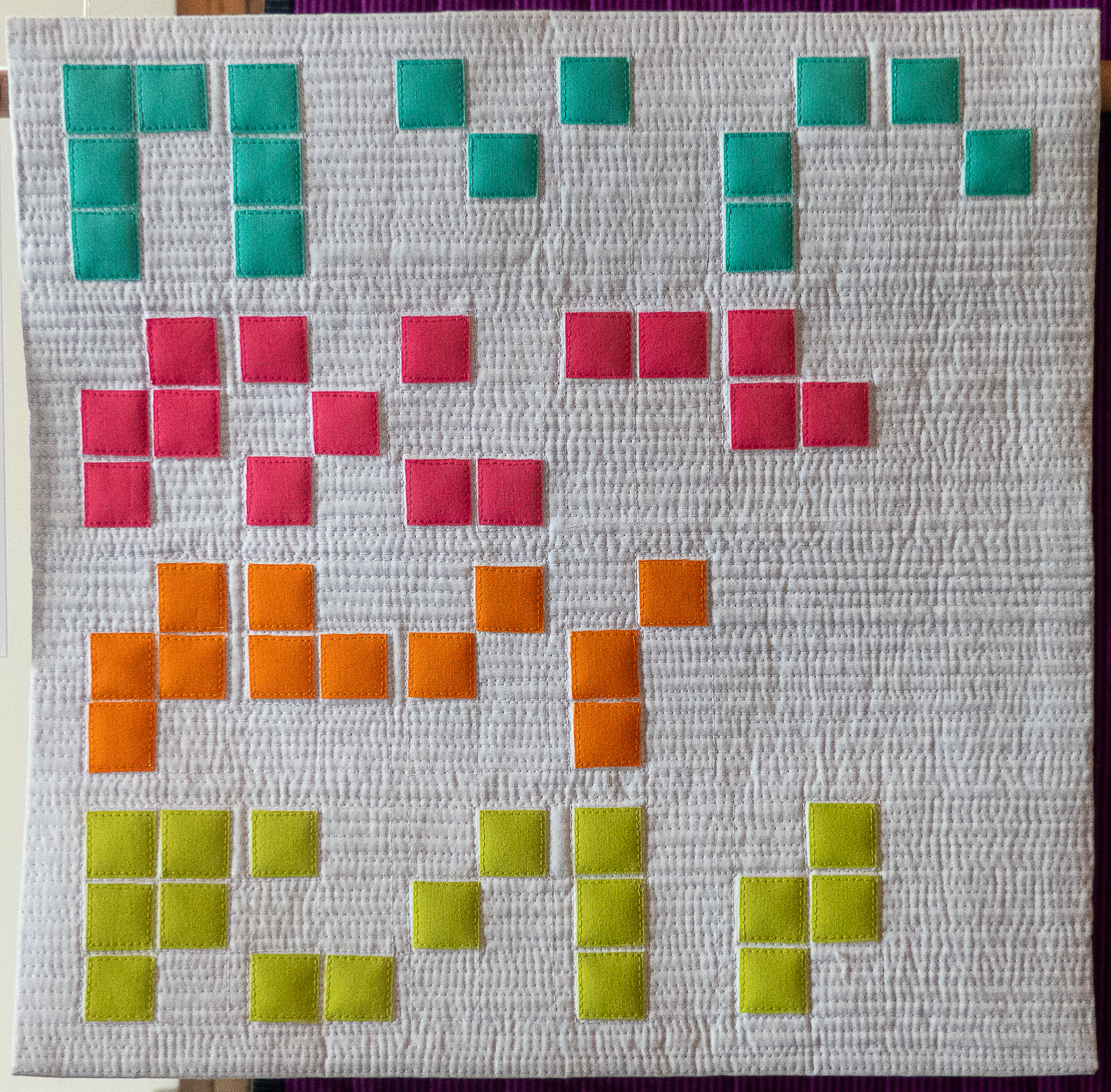 modern quilt with squares in bright colours