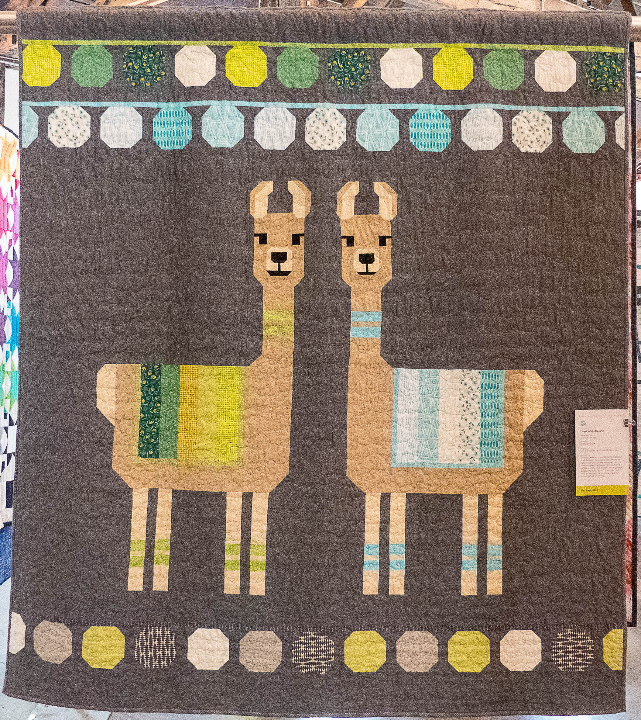 modern quilt containing two llamas