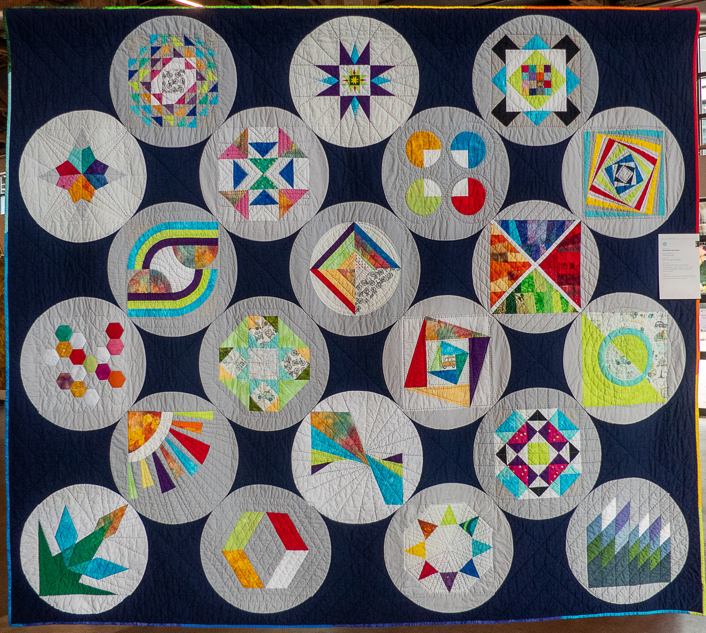 modern quilt with circle shapes containing geometric shapes
